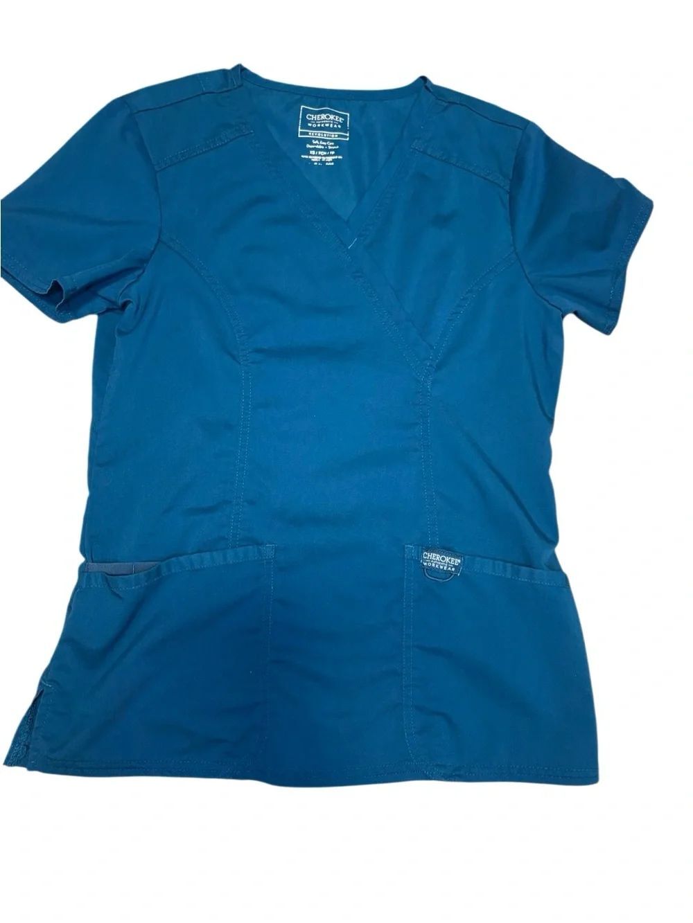Cherokee Workwear Revolution
Mock Wrap Scrub Top. Turquoise. Sz XS. Great Cond